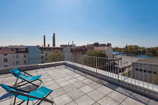 Our sun deck offers a stunning view over the roofs of Berlin.